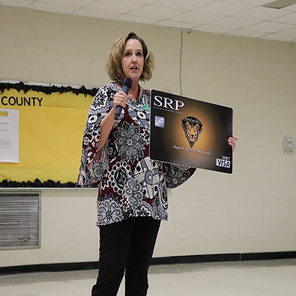 Lady speaking at the front of classroom